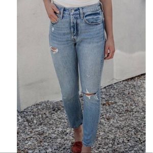 Distressed Levi 501s skinny light wash button fly